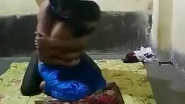 Half-naked young Indian woman allows man to come and touch XXX tits