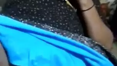 Whore is talking on the phone while lover is touching her Desi vag