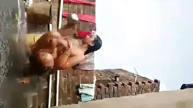 Chubby Indian wife bathing nude on open rooftop