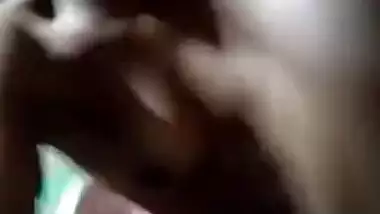 Naked Desi with dark skin does XXX porn on her own in the dark room