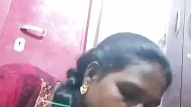 Mature tattooed Tamil wife giving handjob to husband