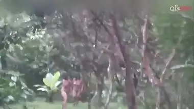 Two hot and sexy Desi aunty bathing in a outdoor under rain together